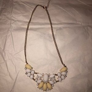Gold necklace with white and beige accents